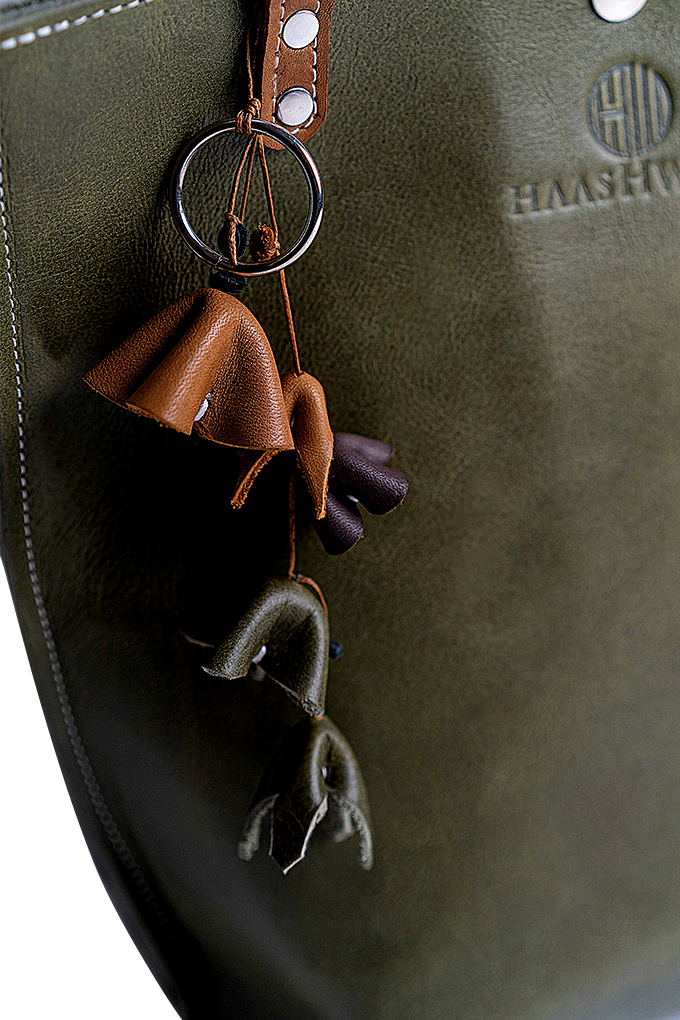 Olive green tote bag with multi colour bag charm