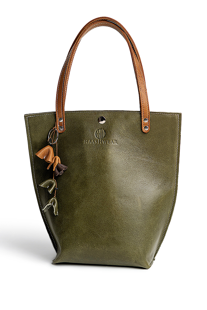 Olive green tote bag with beige handles and bag charms