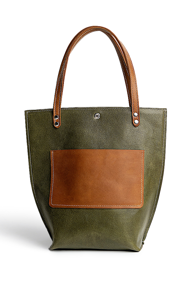 A green tote bag with beige pocket in front