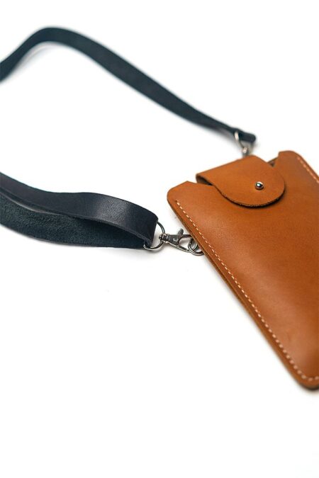 Close up of a leather phone pouch with white background