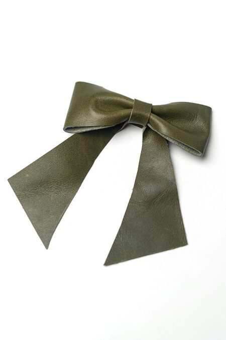 Olive green hair bow on a white background